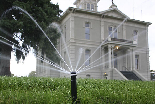 MP Rotator sprinkler irrigating the lawn outside the courthouse in Dayton, Washington.